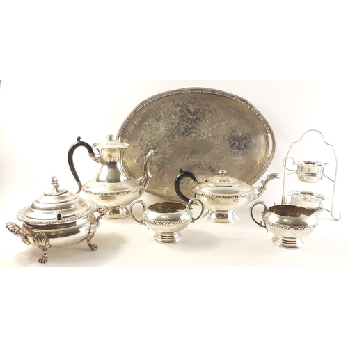 162 - A silver plated lot to include coffee pot, tea pot, cream and sugar, a small lidded tureen and a nic... 