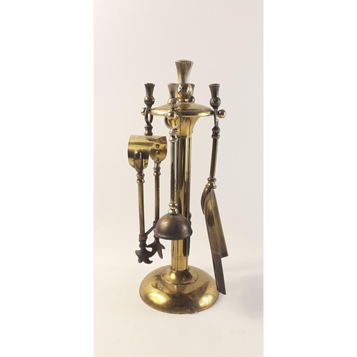 173 - Small brass fireside companion set with thistle finials. 34cm tall approx.#173