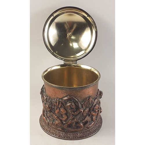 177 - An over-polished copper biscuit barrel standing almost 20cm high with design of cherubs and fish#177... 