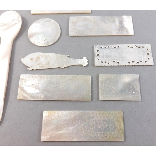 203 - Mother of Pearl lot to include three 10cm spoons, a fish shaped token and seven other decorative pie... 