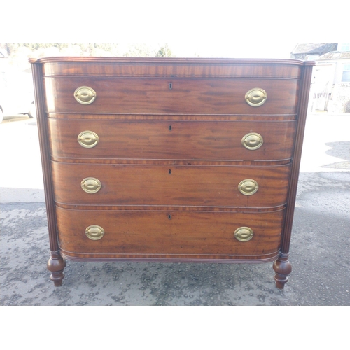 265 - A GEORGIAN bow-fronted four drawer chest of drawers with turned and tapering feet - dimensions 109cm... 