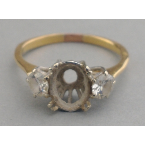 3 - An unmarked yellow metal ring mount with missing centre stone.  The two side stones each approx 3mm ... 