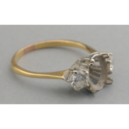 3 - An unmarked yellow metal ring mount with missing centre stone.  The two side stones each approx 3mm ... 