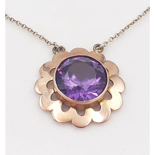 32 - A BEAUTIFUL 9ct stamped pendant and chain with a large central round amethyst - gross weight 4.33g a... 