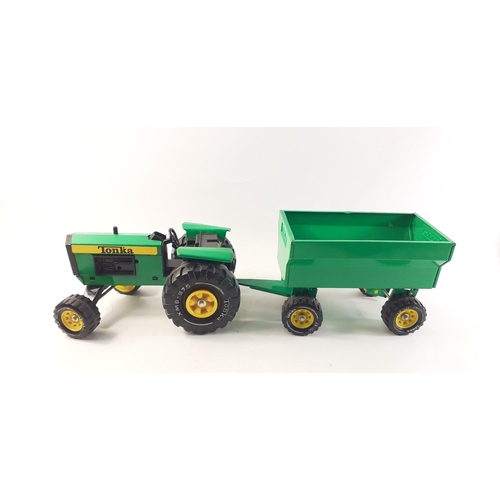 326 - A vintage TONKA XMB-975 green metal tractor with trailer.  Few very minor scratches on edges.#326... 