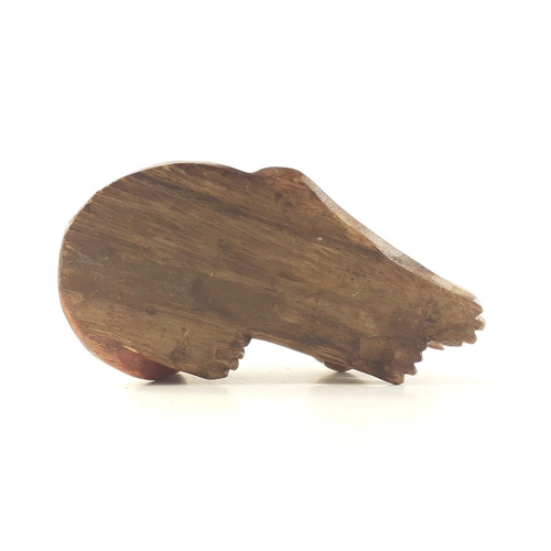 339 - A wooden cat in a restful pose, approx 23cm long#339