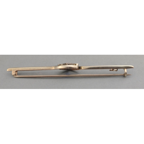 34 - An unmarked white metal pin bar brooch ART DECO styled with two supporting diamonds (tested) with a ... 