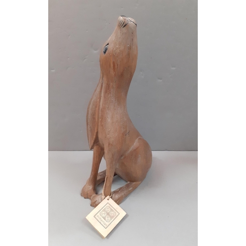 346 - Wooden carved model of a hare with label by Archipelago. Stands 31cm tall approx.#346