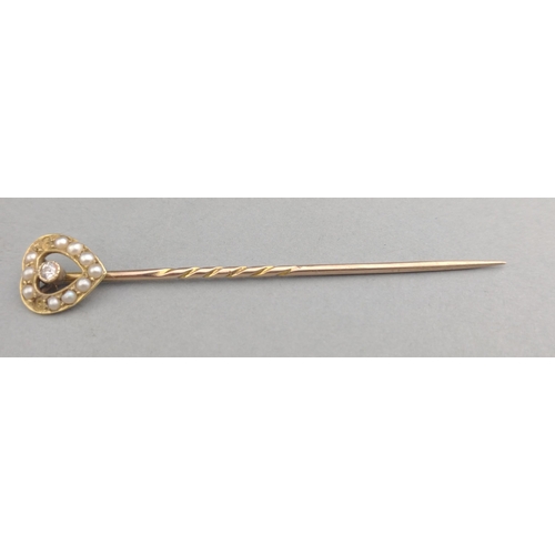 37 - A VINTAGE  LOVEHEART shaped stick pin unmarked yellow metal (does not react to a magnet) with a brig... 