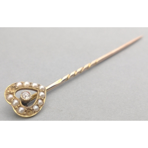 37 - A VINTAGE  LOVEHEART shaped stick pin unmarked yellow metal (does not react to a magnet) with a brig... 