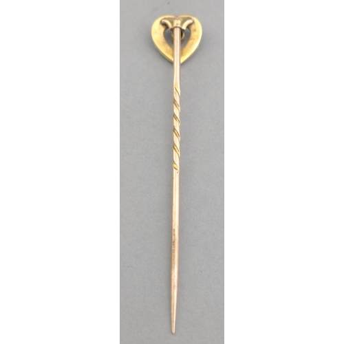 37 - A VINTAGE  LOVEHEART shaped stick pin unmarked yellow metal (does not react to a magnet) with a brig... 