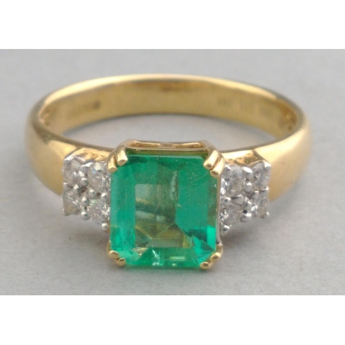 40 - A 750 stamped yellow gold ring with a large square-cut EMERALD supported with 4 diamonds (tested) on... 