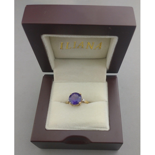 43 - A 10K stamped gold 375 hallmarked ring with 14mm amethyst centre stone and two small diamonds to sho... 