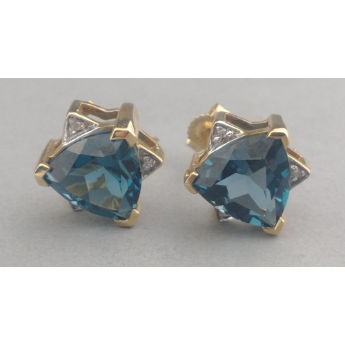 48 - A pair of 375 stamped LARGE JAIPUR INDIAN SAPPHIRE and small diamond (tested) stud earrings in a sta... 