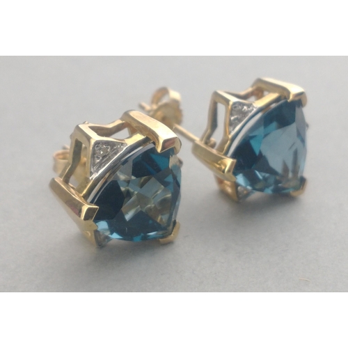 48 - A pair of 375 stamped LARGE JAIPUR INDIAN SAPPHIRE and small diamond (tested) stud earrings in a sta... 