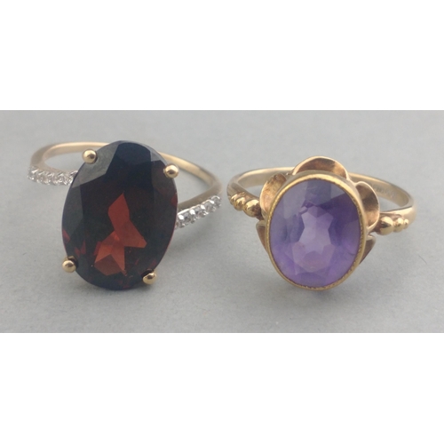 50 - A 375 stamped gold ring with a large AMETHYST stone centred - size M, gross weight  2.21g approx wit... 