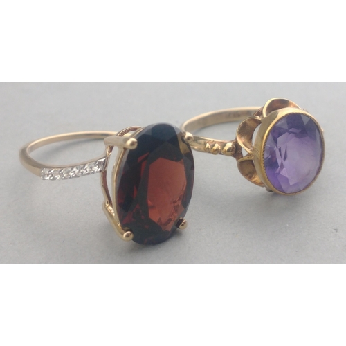 50 - A 375 stamped gold ring with a large AMETHYST stone centred - size M, gross weight  2.21g approx wit... 