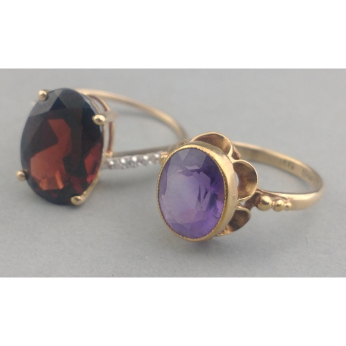 50 - A 375 stamped gold ring with a large AMETHYST stone centred - size M, gross weight  2.21g approx wit... 