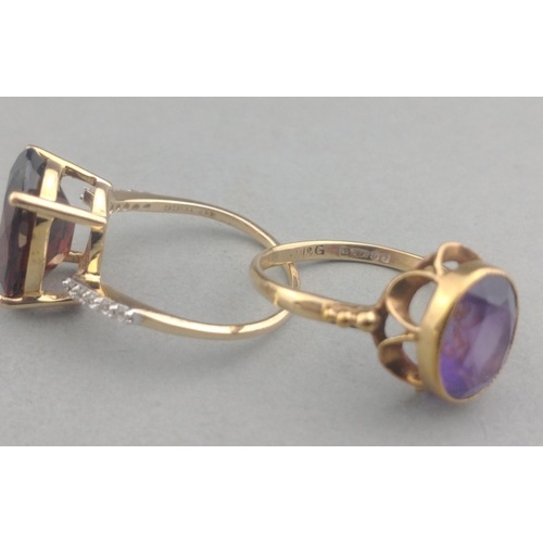 50 - A 375 stamped gold ring with a large AMETHYST stone centred - size M, gross weight  2.21g approx wit... 