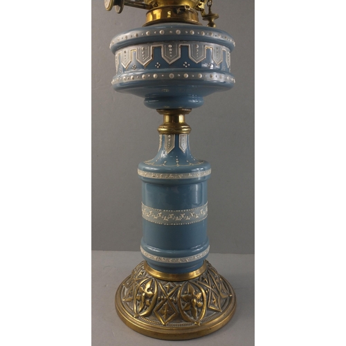 554 - A beautiful blue ceramic oil lamp with brass HINKS & Co. fittings. Complete with chimney. Height... 