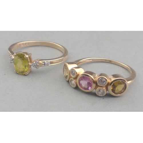 58 - Two 375 stamped rings one with a PERIDOT centred stone the other ring with coloured stones - ring si... 