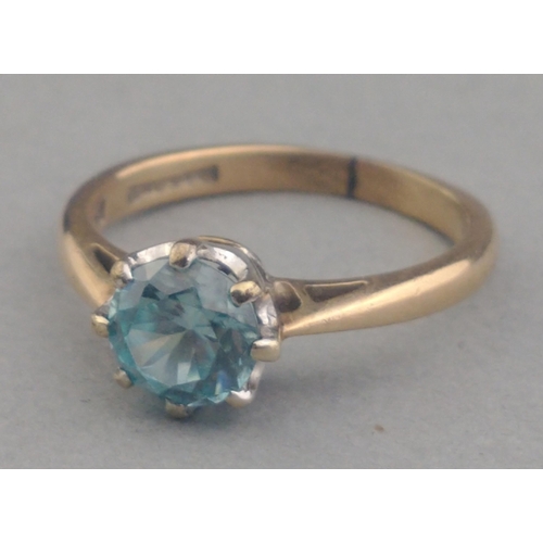 66 - A 9ct stamped ring with a Jaipur blue centre stone Size I. Gross weight 2.05g approx.#66