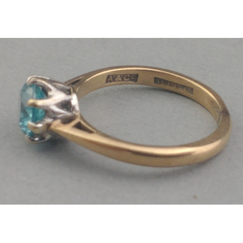 66 - A 9ct stamped ring with a Jaipur blue centre stone Size I. Gross weight 2.05g approx.#66