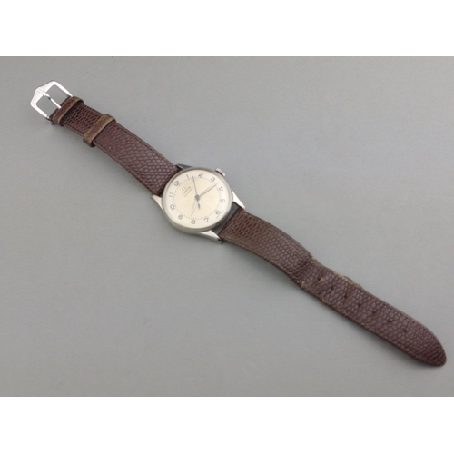 91 - A VINTAGE OMEGA BUMPER non-magnetic wristwatch with brown leather strap - not working at time of val... 