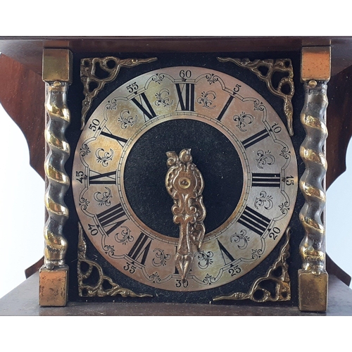 281 - A large ornate pendulum clock with brass movement and striker.  Includes heavy brass pendulum weight... 