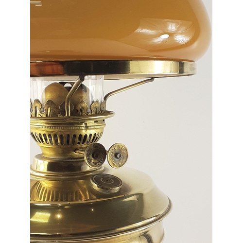 560 - A stunning large brass oil lamp with Corinthian column base and duplex burner. Lovely butterscotch g... 