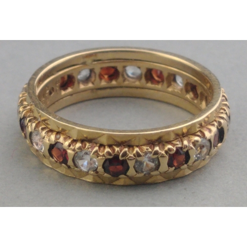31A - A 375 stamped 9ct gold eternity ring set with white stones and red stones.  Size L. Gross weight 3.3... 
