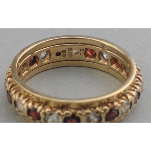 31A - A 375 stamped 9ct gold eternity ring set with white stones and red stones.  Size L. Gross weight 3.3... 