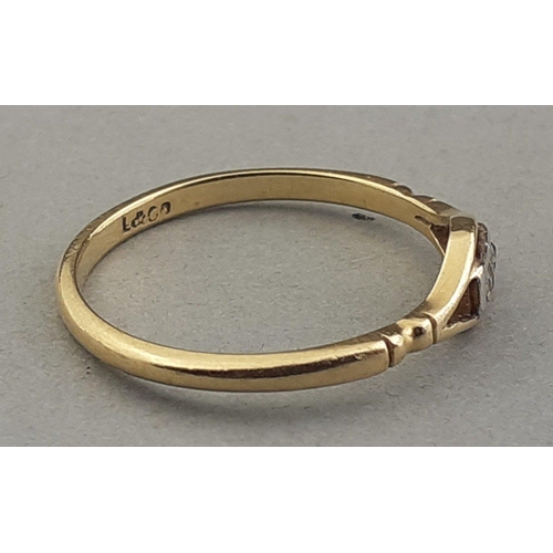 47 - An 18ct stamped ring size O with two small white stones inset - gross weight 1.68g approx#48