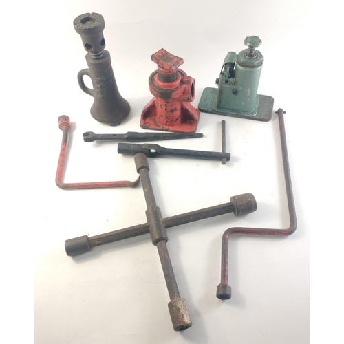 147 - A mixed lot containing three bottle jacks, hand starter etc.#193