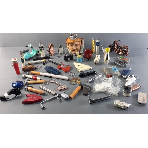 169 - A large quantity of novelty lighters in shape of tools, binoculars, motorbikes, lightbulb, bowling b... 