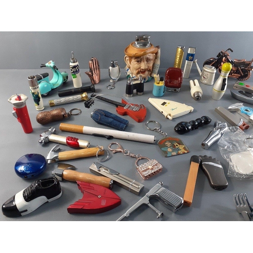 169 - A large quantity of novelty lighters in shape of tools, binoculars, motorbikes, lightbulb, bowling b... 