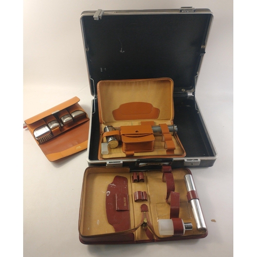 177 - A hard shell custom briefcase containing three gents travel sets.  A useful group.#223