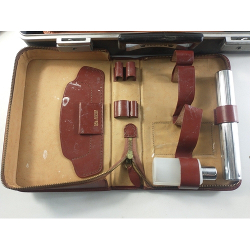 177 - A hard shell custom briefcase containing three gents travel sets.  A useful group.#223