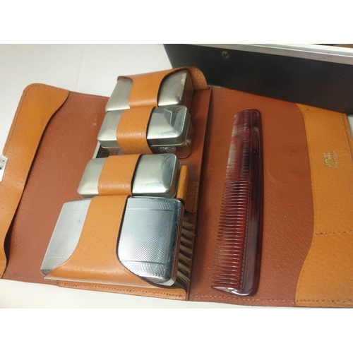 177 - A hard shell custom briefcase containing three gents travel sets.  A useful group.#223