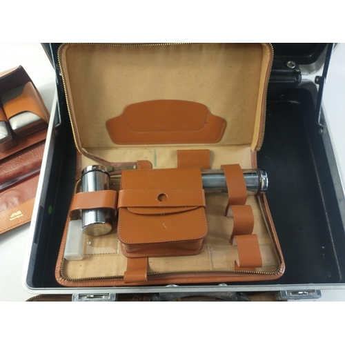 177 - A hard shell custom briefcase containing three gents travel sets.  A useful group.#223