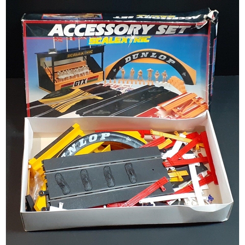 196 - SCALEXTRIC accessory set containing bridge etc.  Has been used.#242