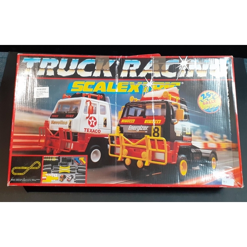198 - SCALEXTRIC truck racing.  Contains trucks, controllers etc.  in playworn condition.#244