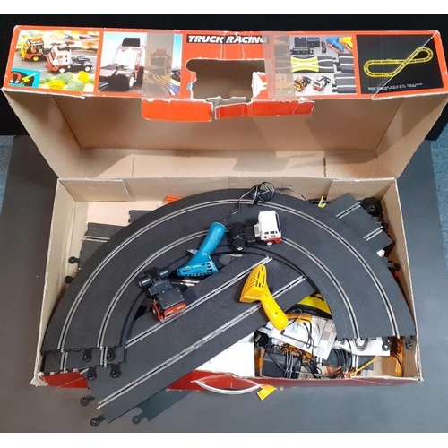 198 - SCALEXTRIC truck racing.  Contains trucks, controllers etc.  in playworn condition.#244