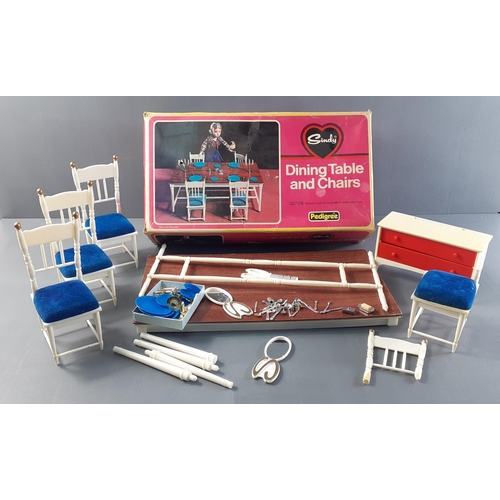 204 - A WHOLE WORLD OF FUN! c1970's SINDY dining table and chairs (one chair broken but part with the box)... 