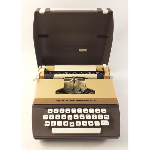 207 - A PETITE SUPER INTERNATIONAL child's typewriter in case.#253