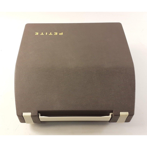 207 - A PETITE SUPER INTERNATIONAL child's typewriter in case.#253