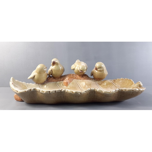 214 - A cute pottery dish with 4 wee birds perched along the edge.  Measures 39cm approx.  No damage noted... 