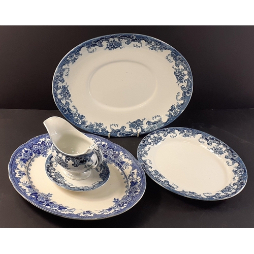 215A - Small lot of blue of white ceramic items to include gravy boat and tray and three platters the large... 