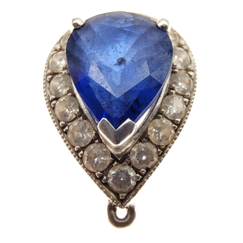 25 - A nice quality 750 stamped white gold and DIAMOND tested pendant with a blue sapphire centred - gros... 