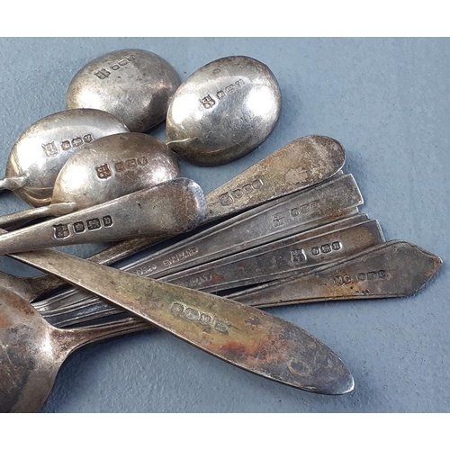 48 - Nine silver hallmarked spoons and one silver pickle spoon.  Weight 107g approx#53